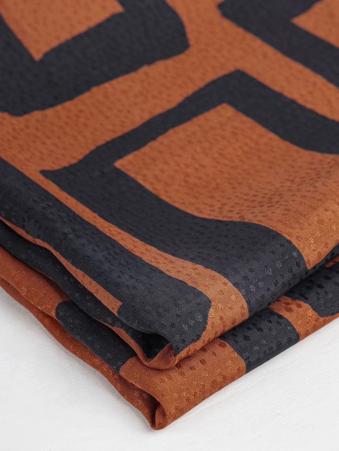 Geo Square Print Viscose Dobby - Pumpkin   Charcoal - Swatch